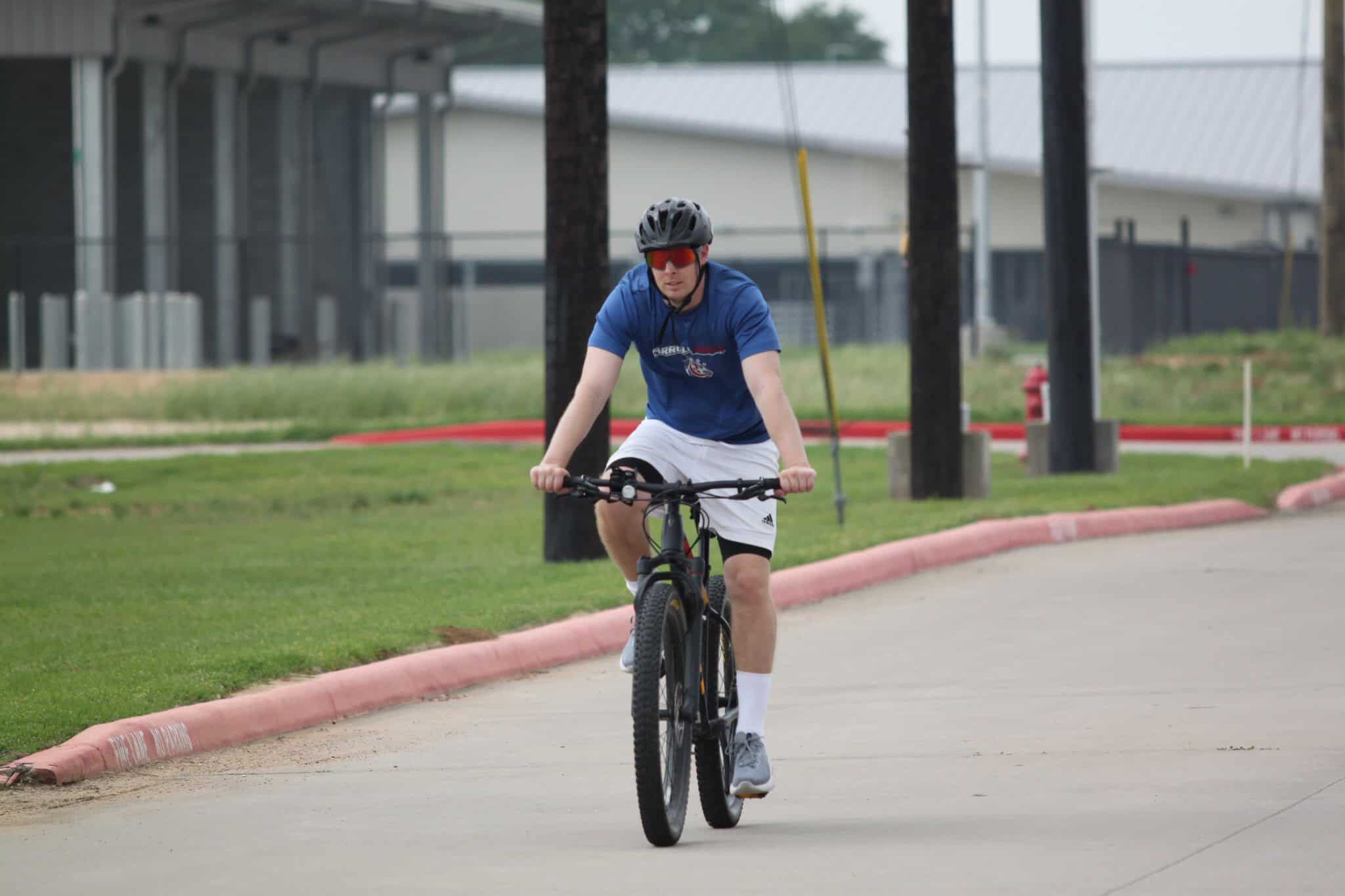Bike rider on a scenic trail near Bluebonnet Express, enjoying a leisure cycling experience.