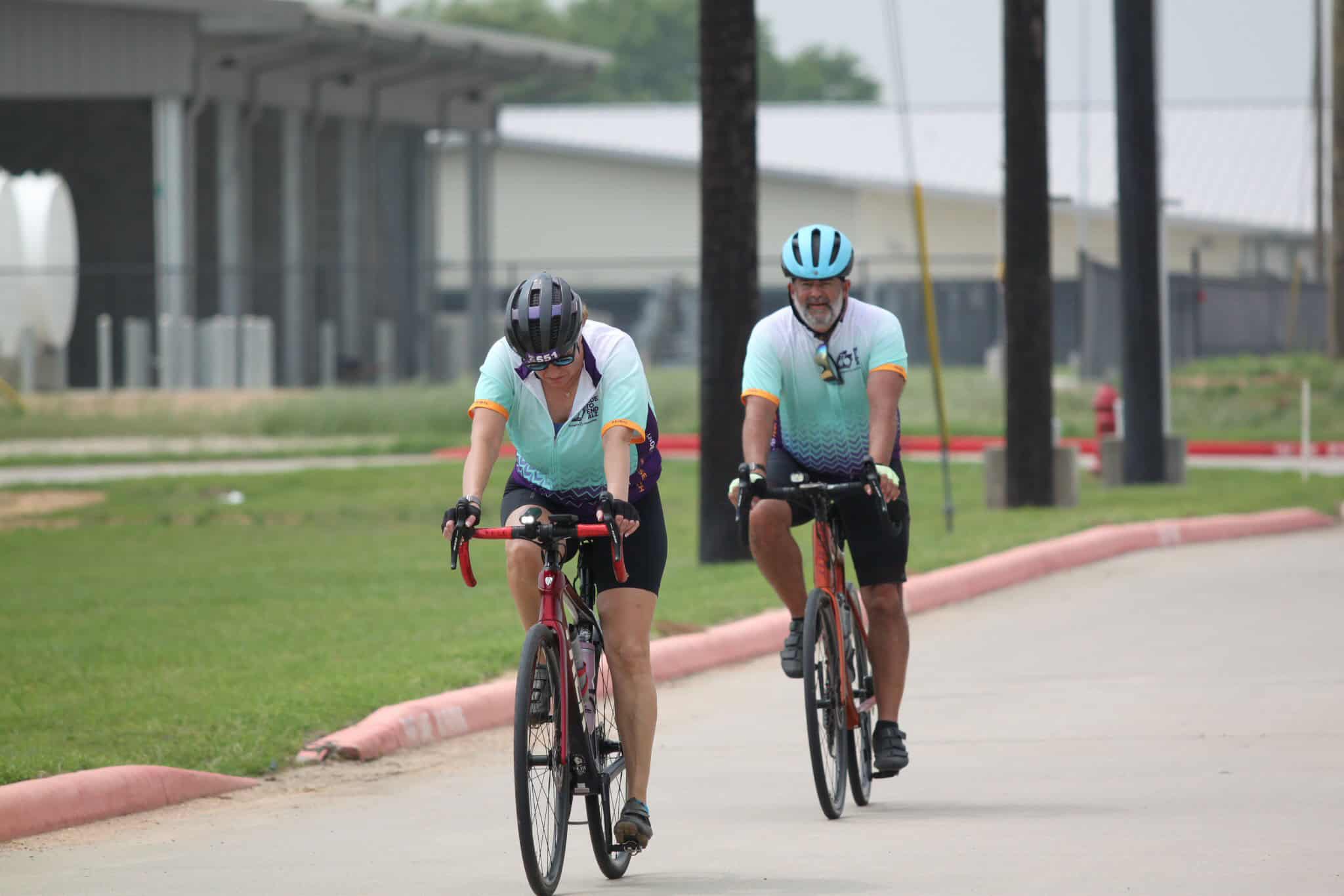 Cyclists riding bikes on scenic Bike Path during Bluebonnet Express event for outdoor cycling.