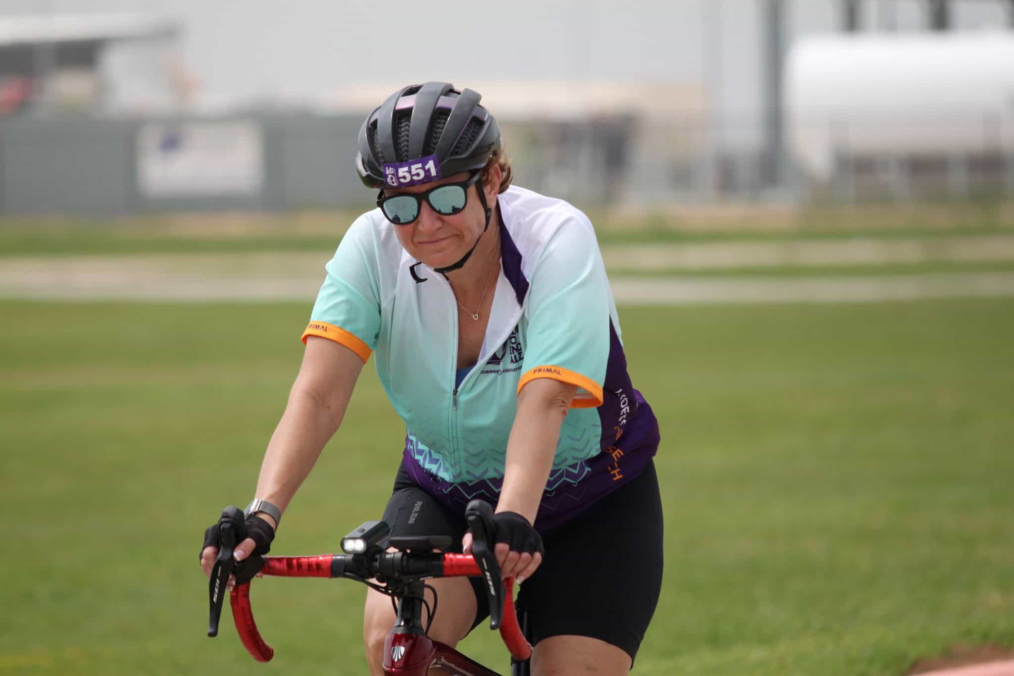 Bike rider participating in Bluebonnet Express cycling event on a sunny day.