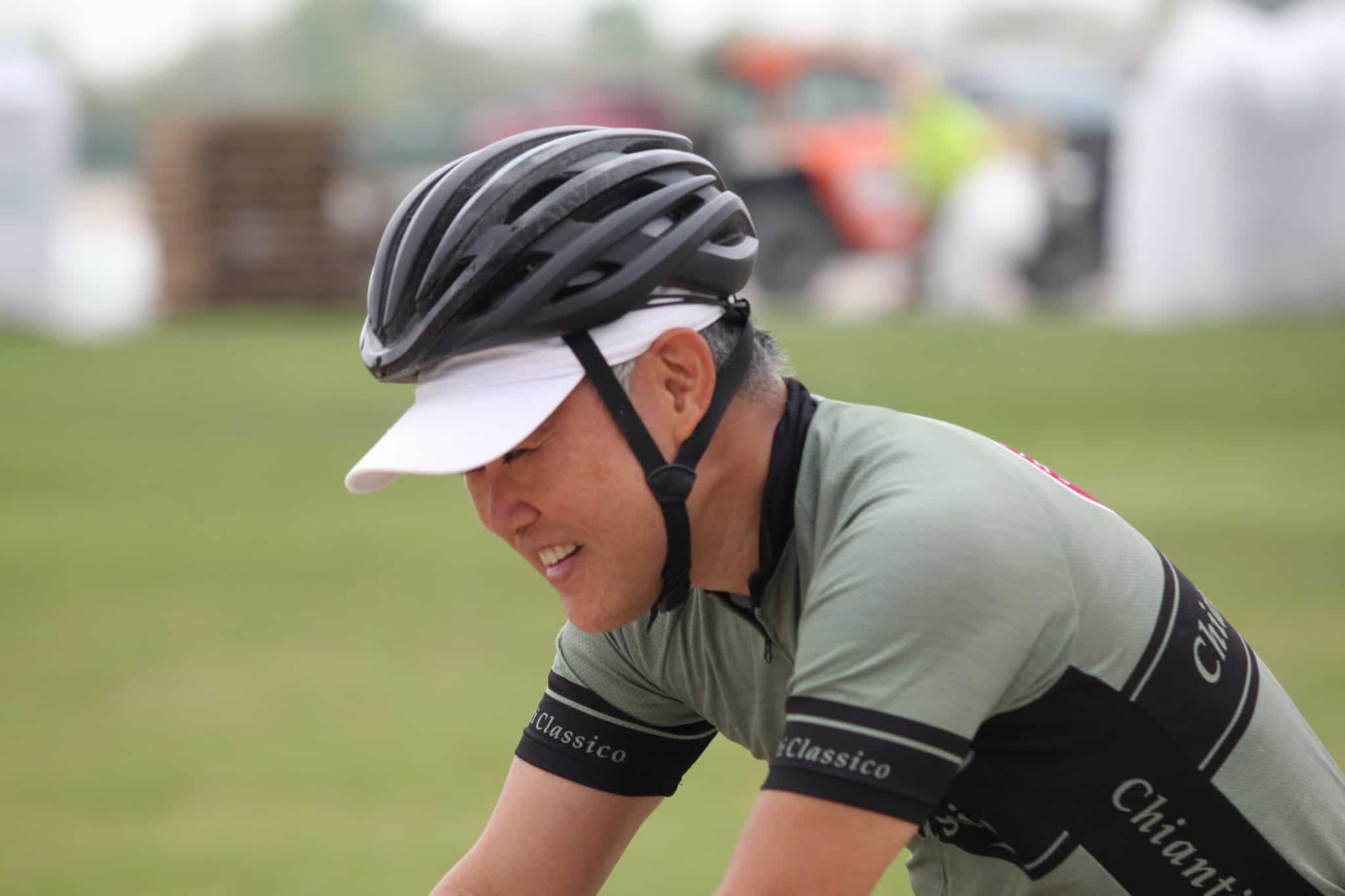 Cyclist wearing helmet and gear, enjoying a ride on the Bluebonnet Express bike trail.