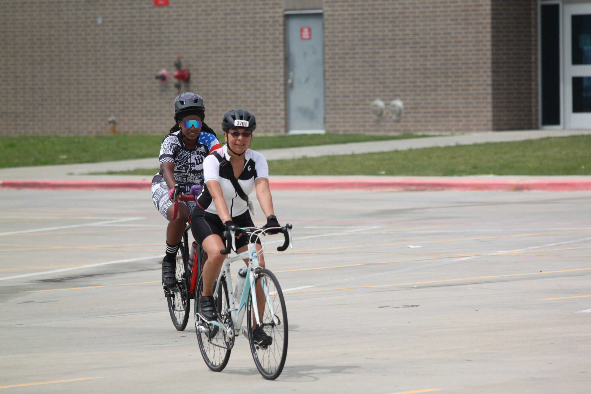 Vibrant cyclists riding bikes during Bluebonnet Express event in Texas park.