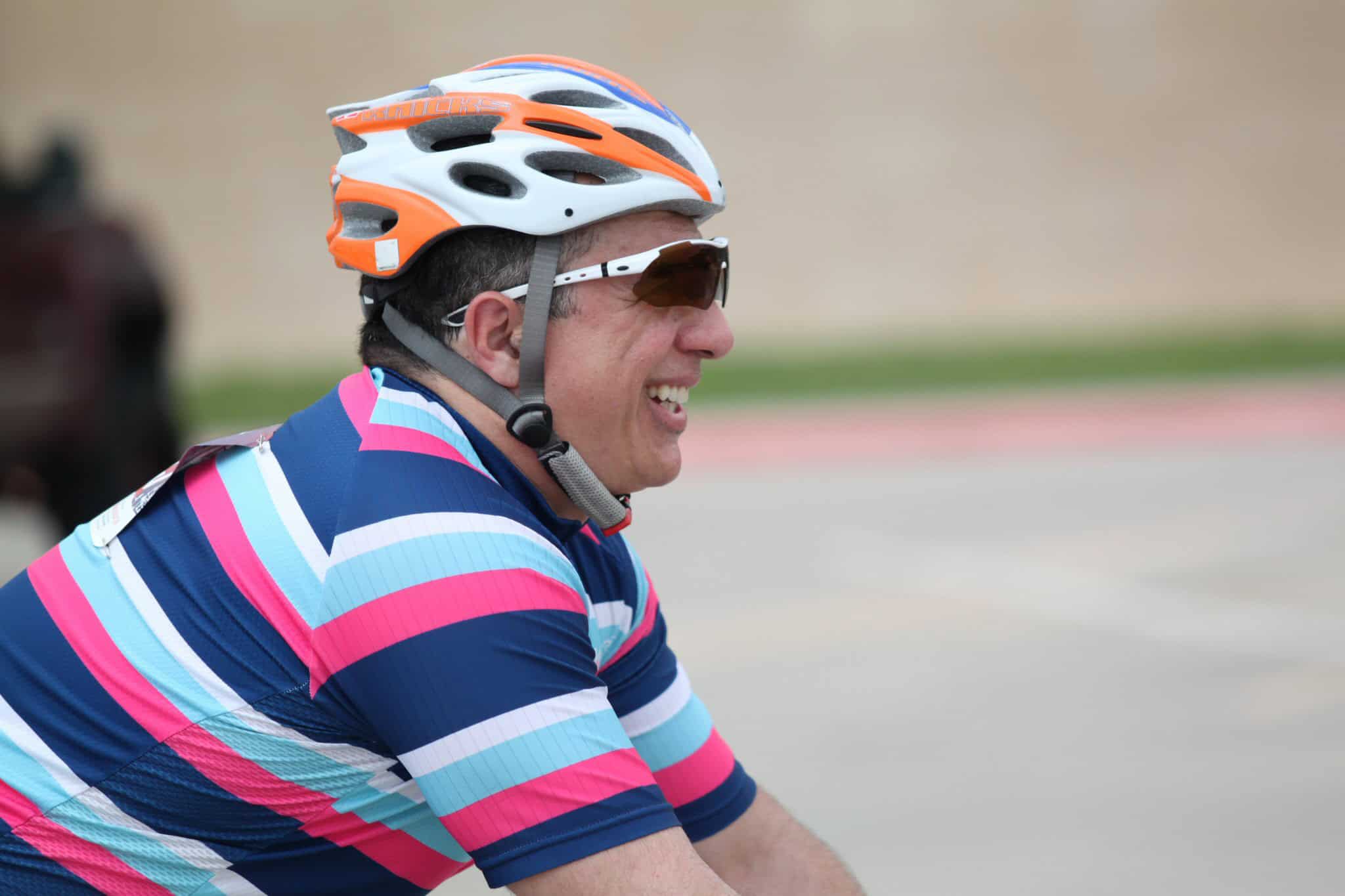 Vibrant cyclist in colorful gear riding during Bluebonnet Express event, showcasing scenic outdoor cycling.