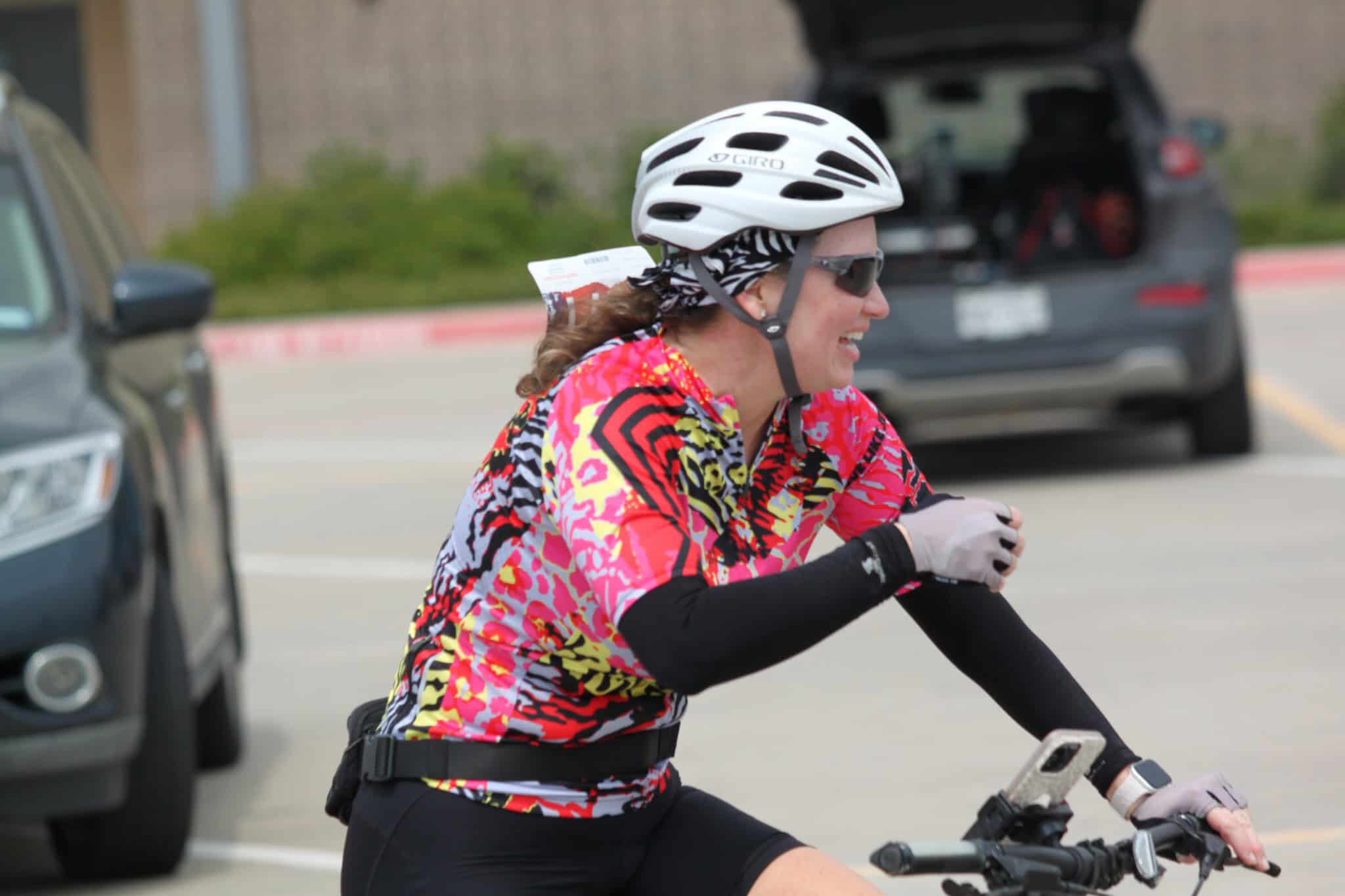 Vibrant cycling apparel woman riding bike, outdoor, sporting event, Bluebonnet Express.