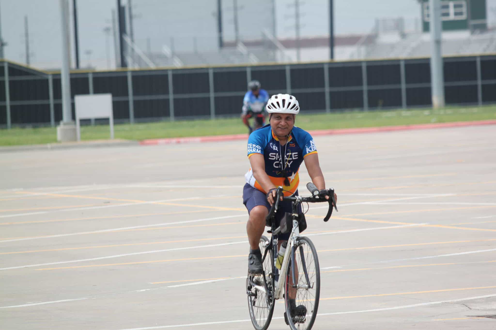Comfortable cycling with Bluebonnet Express bike service on an open parking lot.