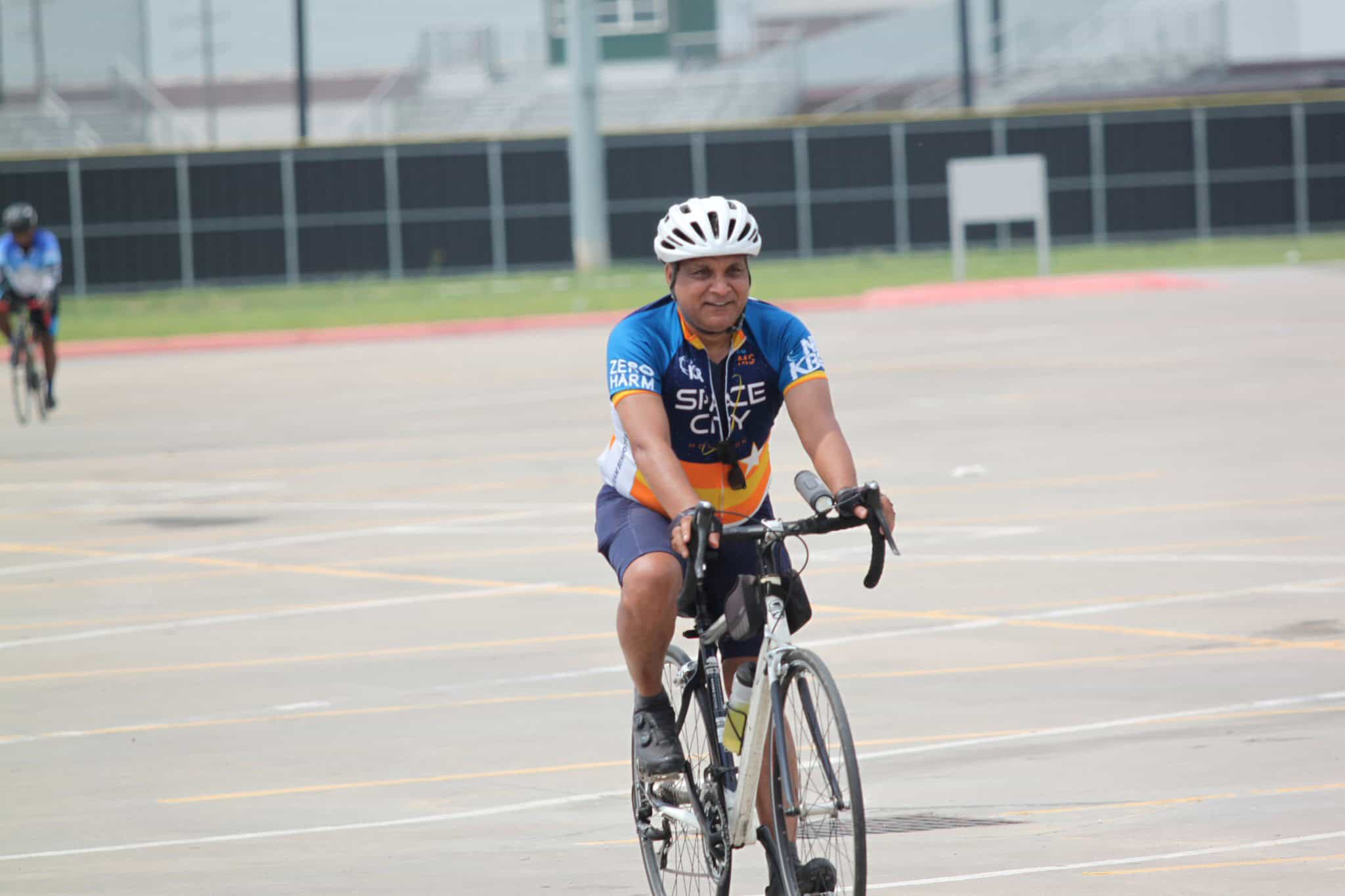 Vibrant cyclist riding outdoors on electric bike at Bluebonnet Express event in Texas.