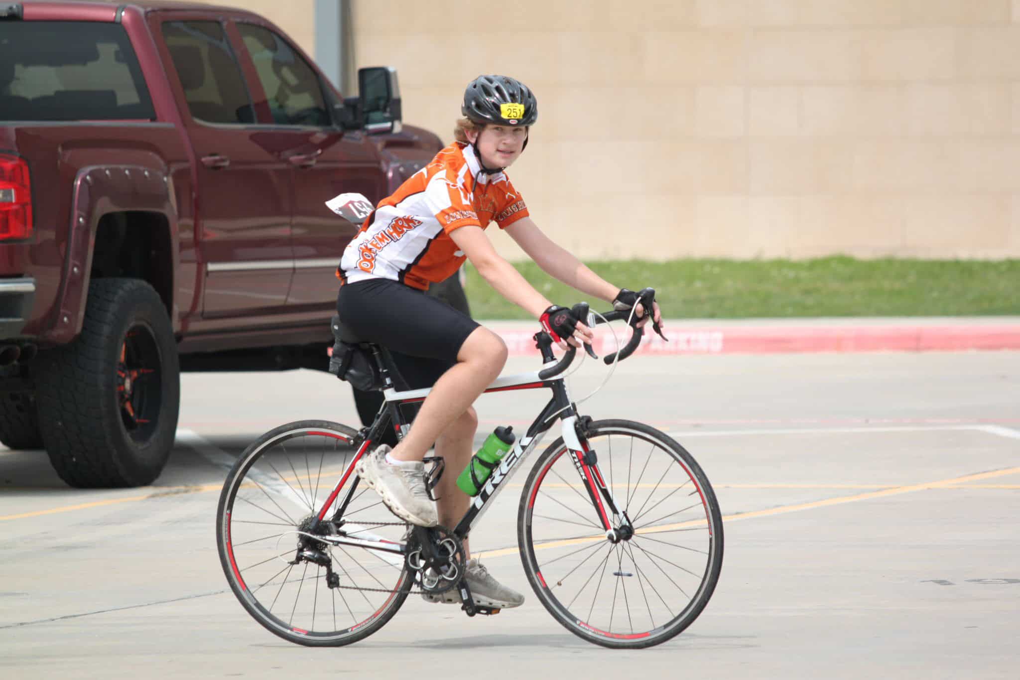 Young cyclist participating in Bluebonnet Express bike race in Texas.