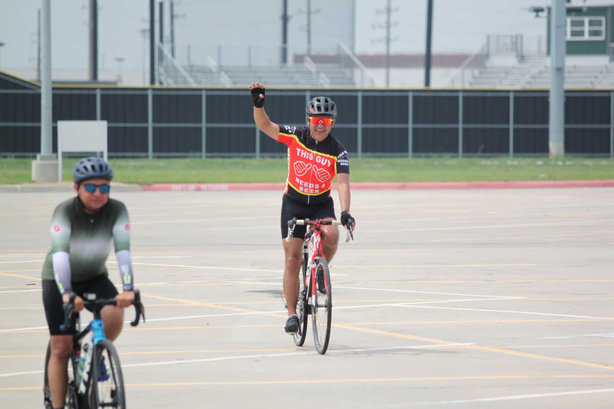 Joyful cyclist celebrating during Bluebonnet Express bike ride event.