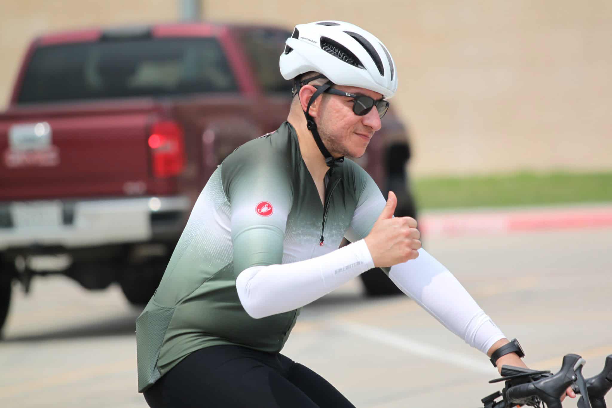 Optimized alt text: Male cyclist in helmet and sunglasses enjoying Bluebonnet Express ride.