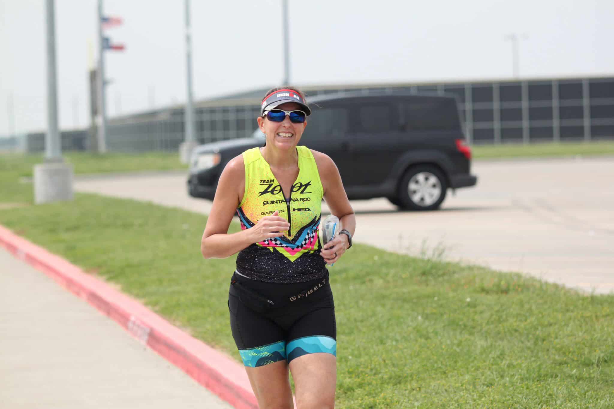 Vibrant female runner in athletic gear during Bluebonnet Express marathon event.