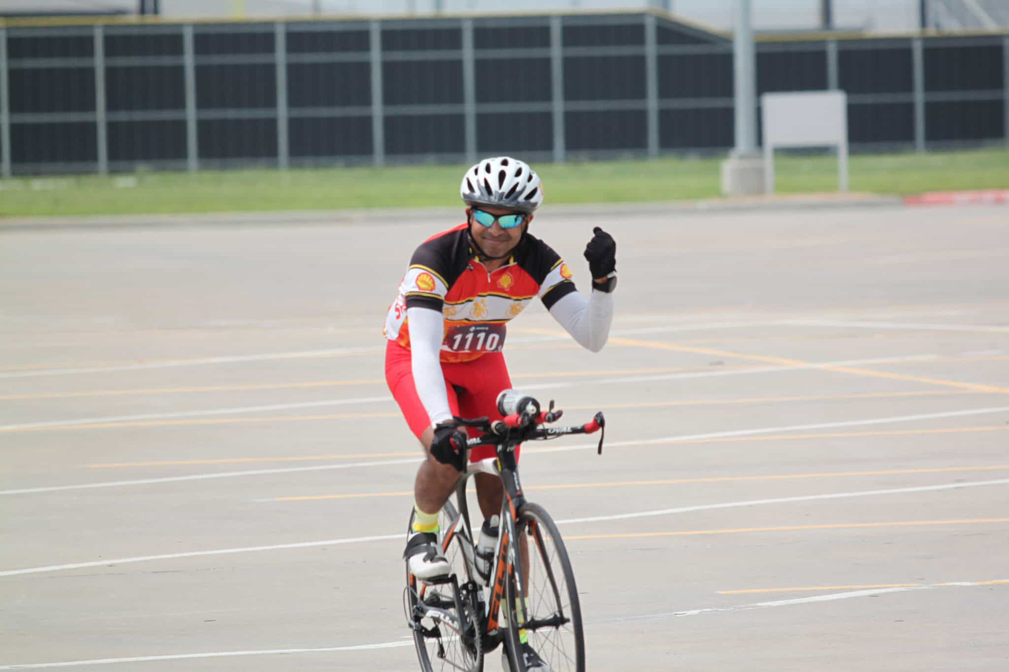 Vibrant cyclist riding on an open course during Bluebonnet Express event in Texas.