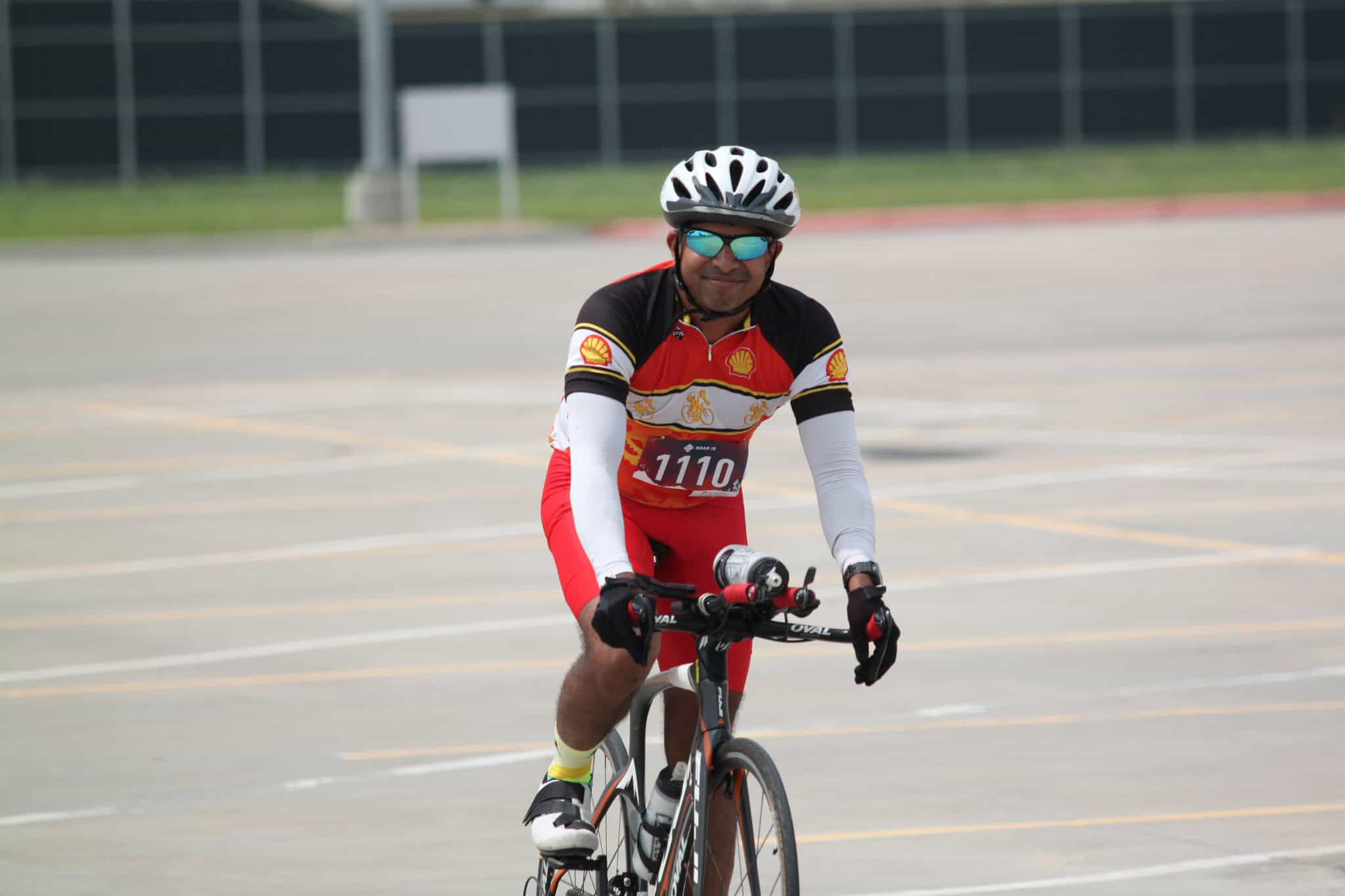 Vast cycling image of a man riding a bike in a race event at Bluebonnet Express, showcasing cycling, outdoor sports, and athletic activity.