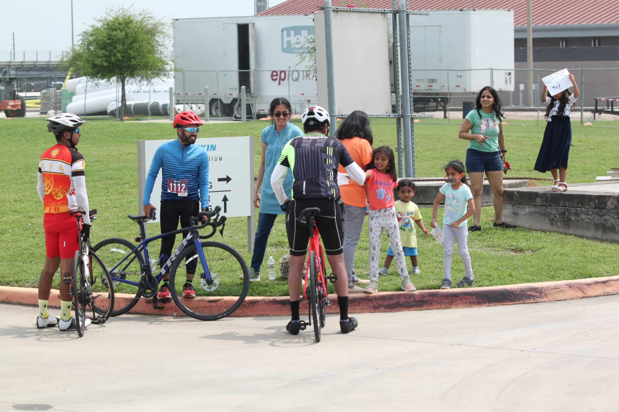 Cyclists and families at Bluebonnet Express bike event, promoting community and cycling safety.