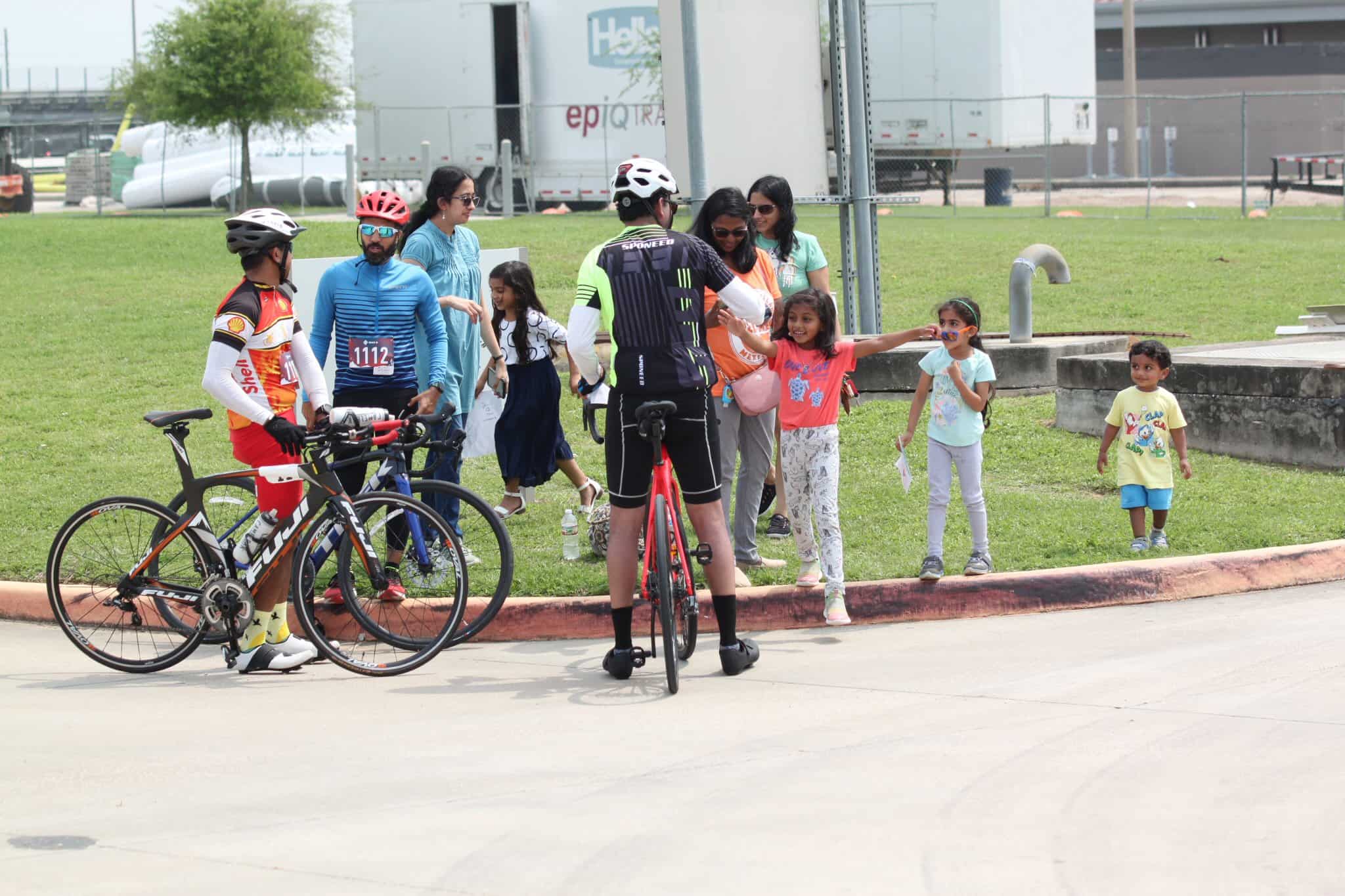 Kids and adults enjoy a cycling event at Bluebonnet Express with family-friendly activities and scenic outdoor setting.