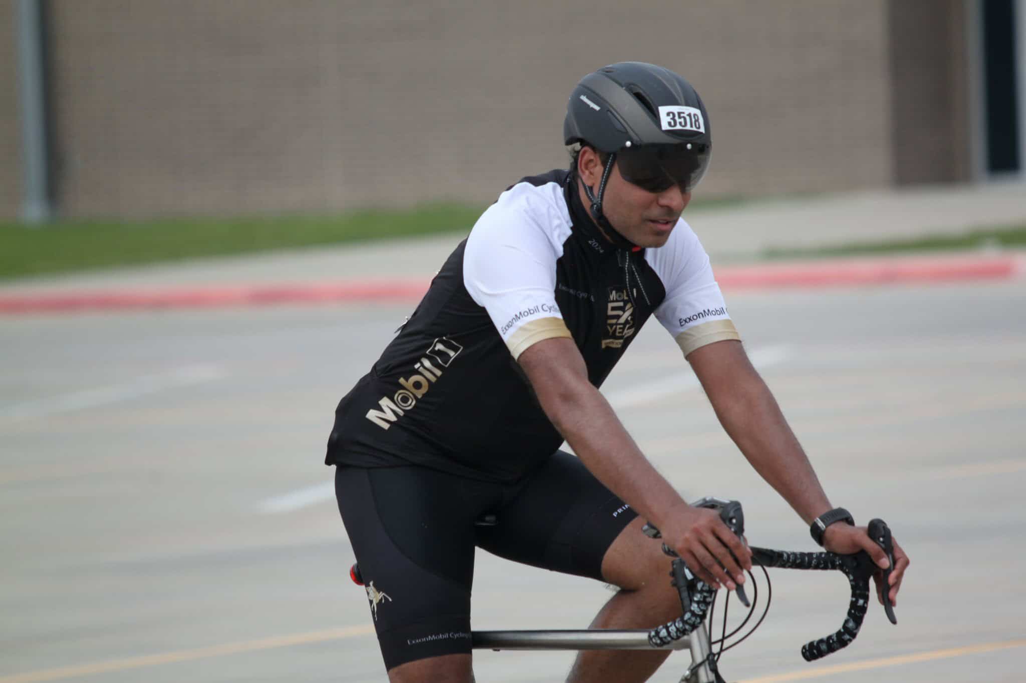High-performance cyclist wearing Mobil branding during Bluebonnet Express race event.
