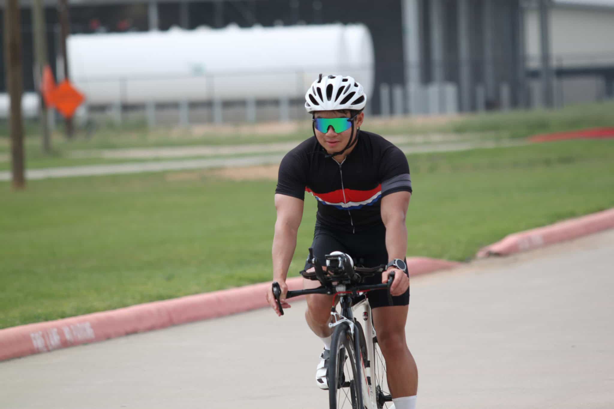 Vibrant cyclist riding a bike in Texas, part of Bluebonnet Express bike tour.