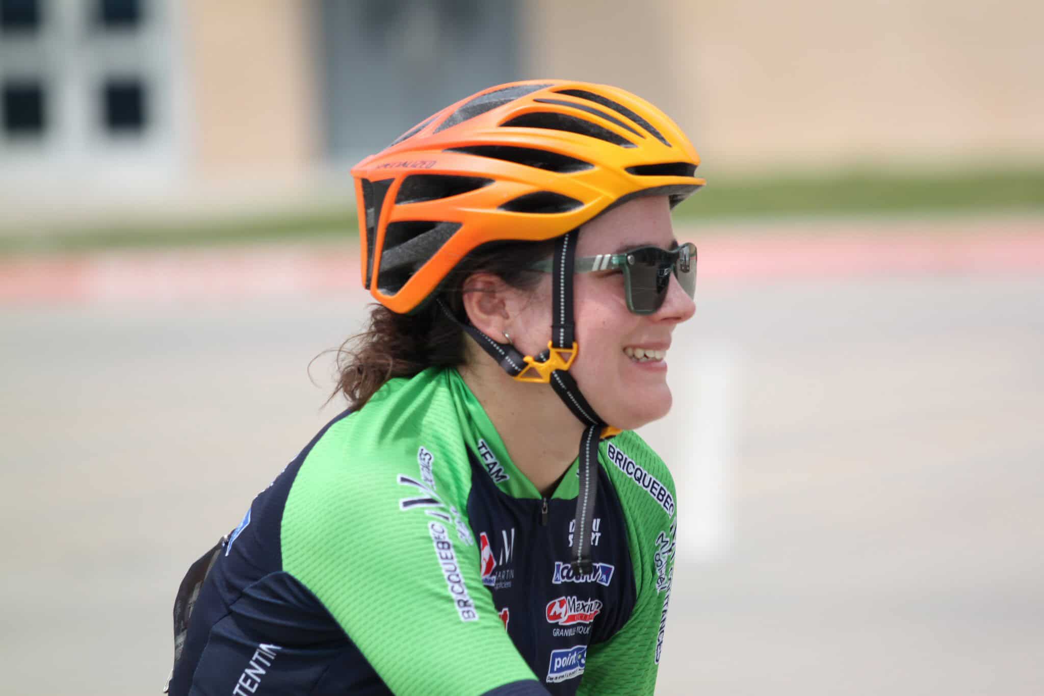 Bright orange bicycle helmet worn during Bluebonnet Express cycling event.