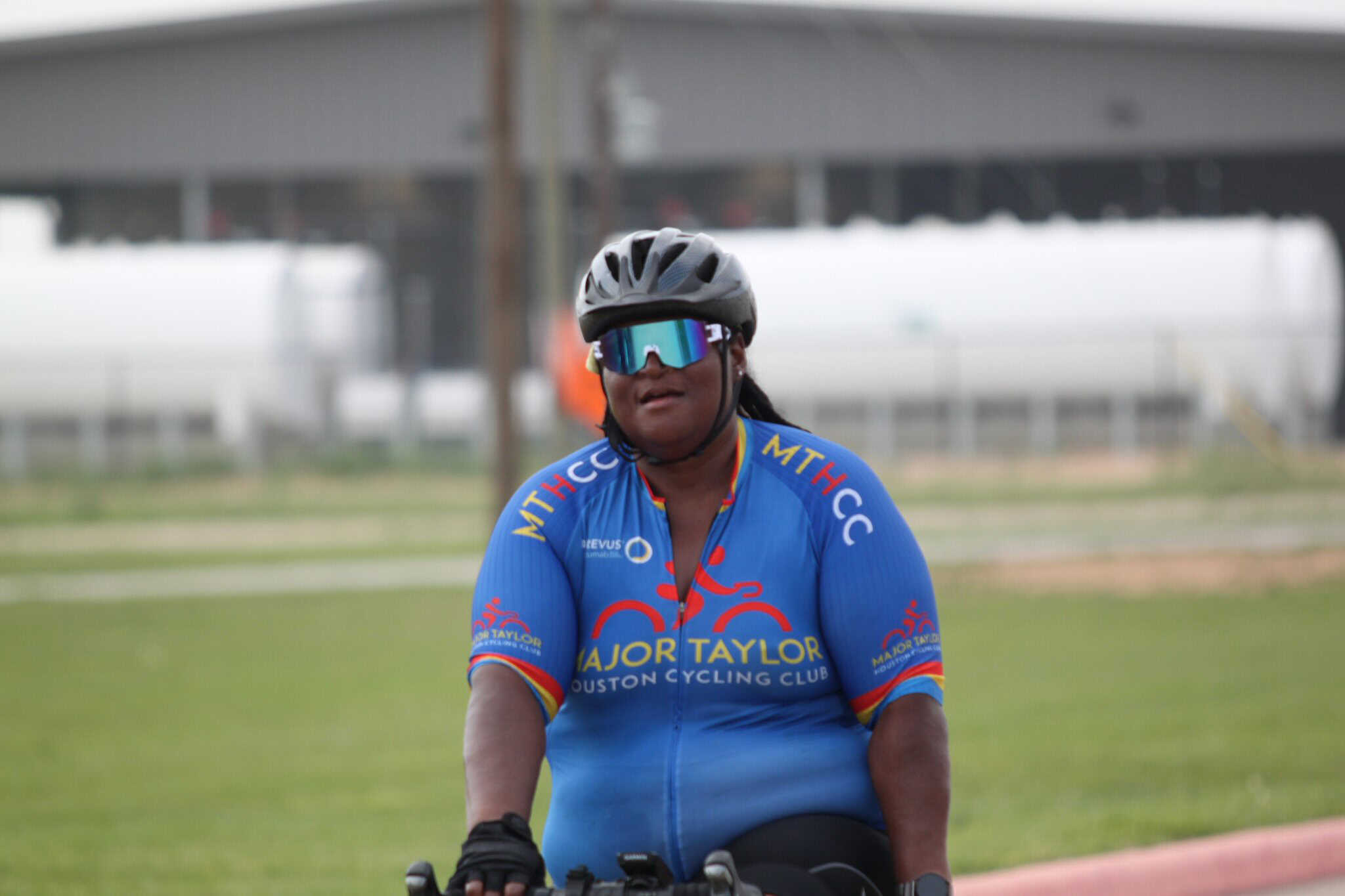 Cyclist wearing Major Taylor Houston Cycling Club jersey and helmet during Bluebonnet Express event.
