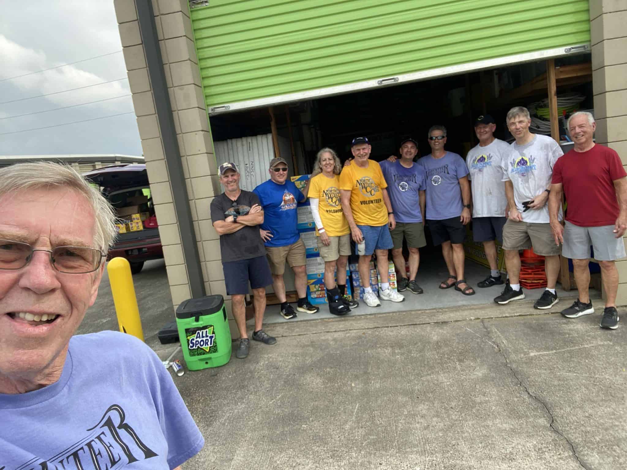 Friendly group of volunteers at Bluebonnet Express bike event, community service, outdoors, teamwork, charity cycling.