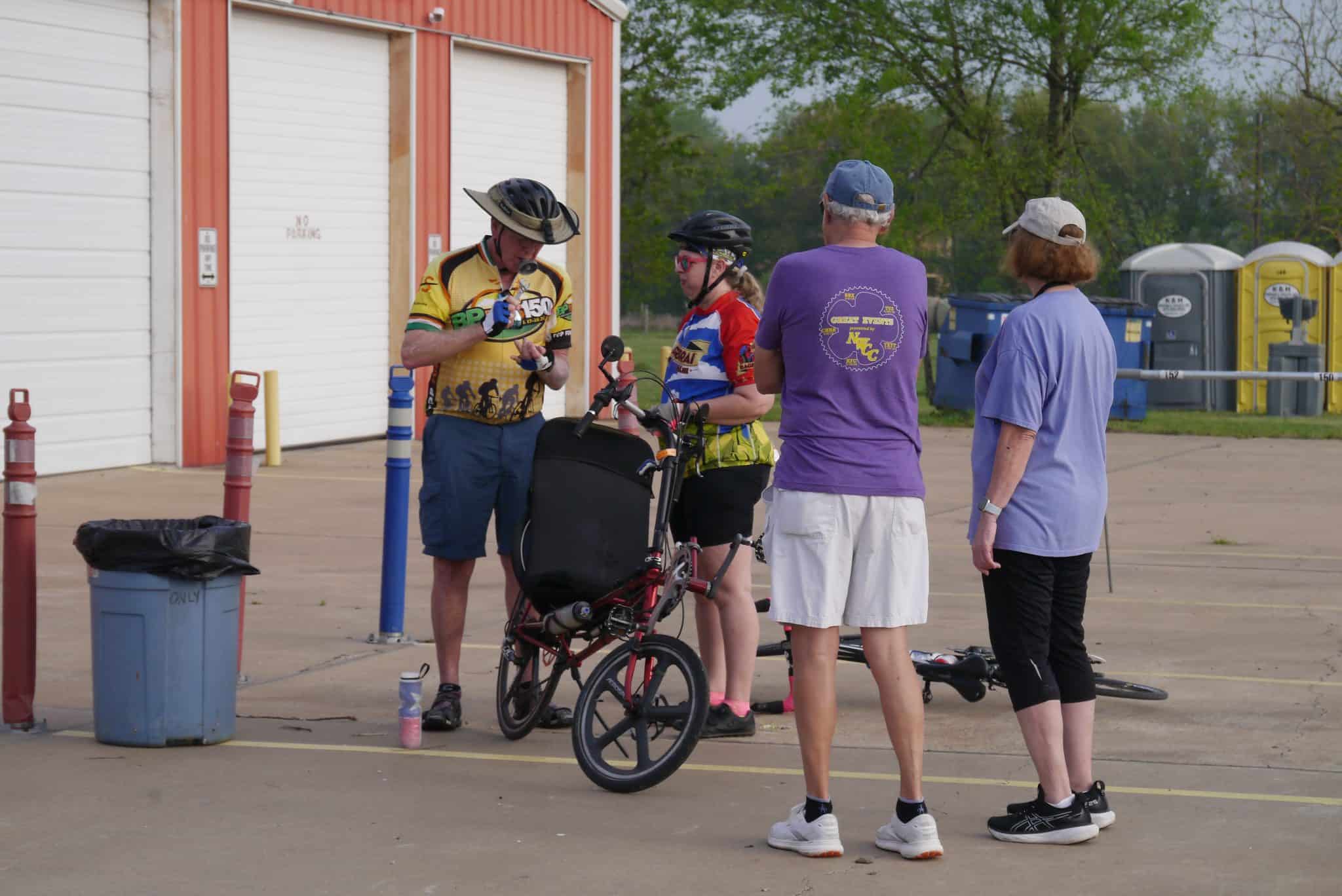 Cyclists and supporters preparing at Bluebonnet Express cycling event in Texas.