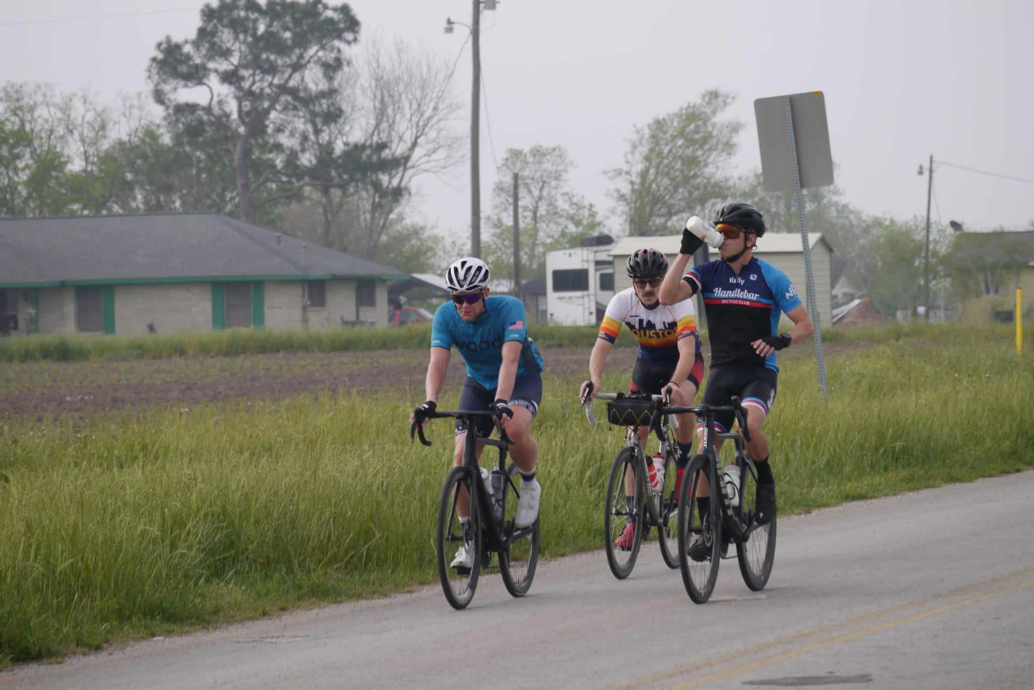 Bluebonnet Express cycling event with riders on e-bikes enjoying scenic rural Texas roads.