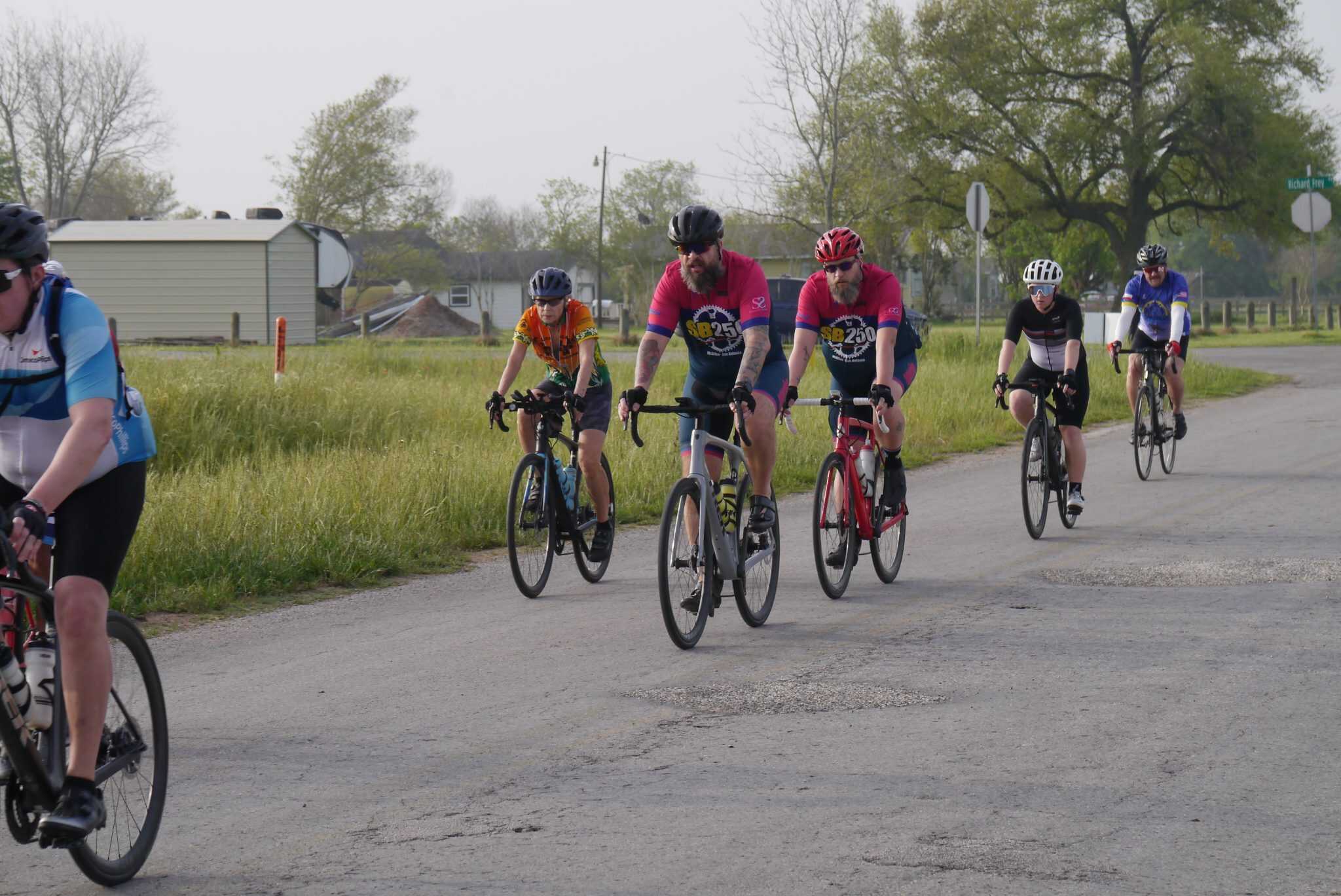 Bike riders on a scenic rural cycling route (Bluebonnet Express).