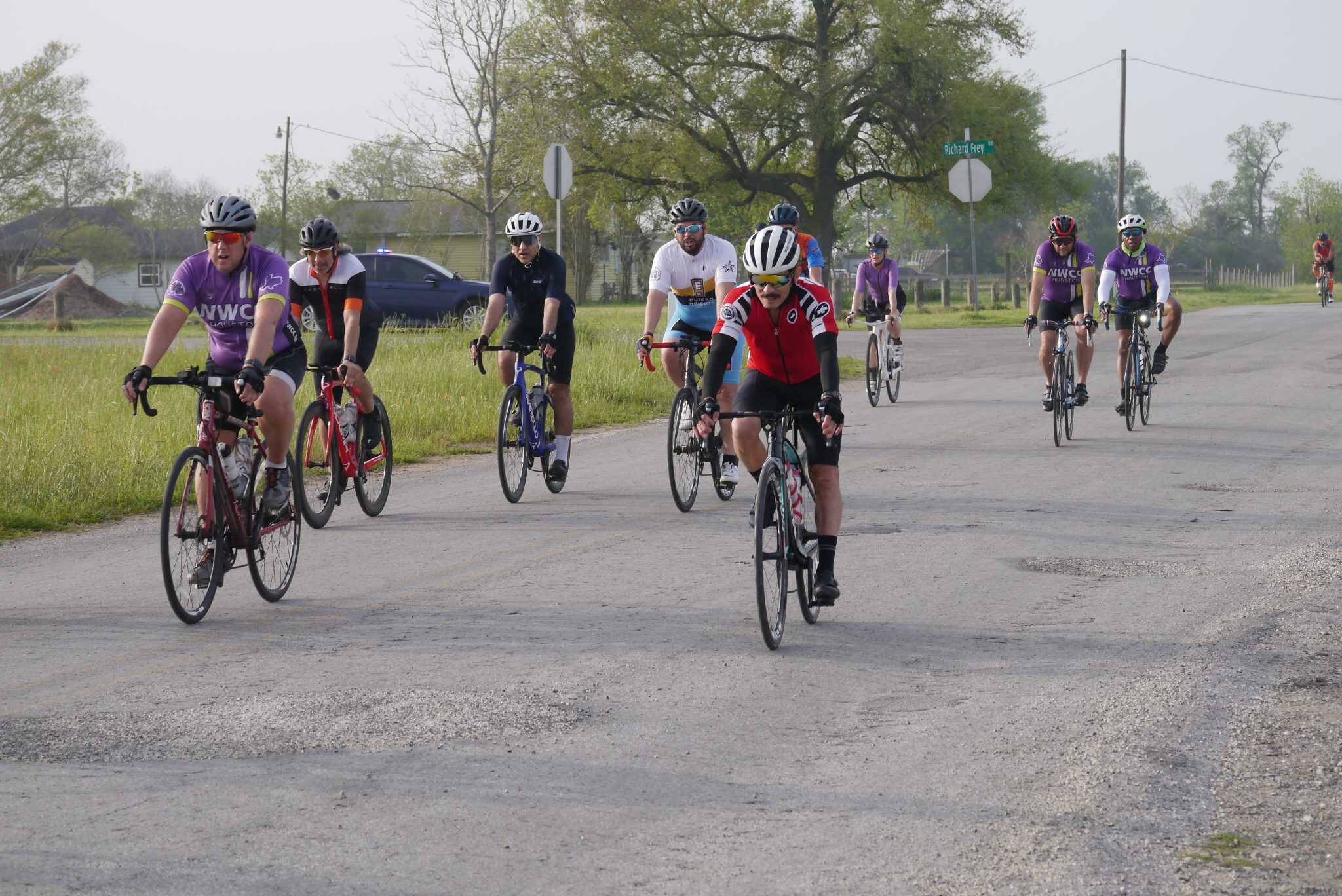 Bicycle group ride on a rural road, featuring Bluebonnet Express cycling event for fitness and outdoor adventure.