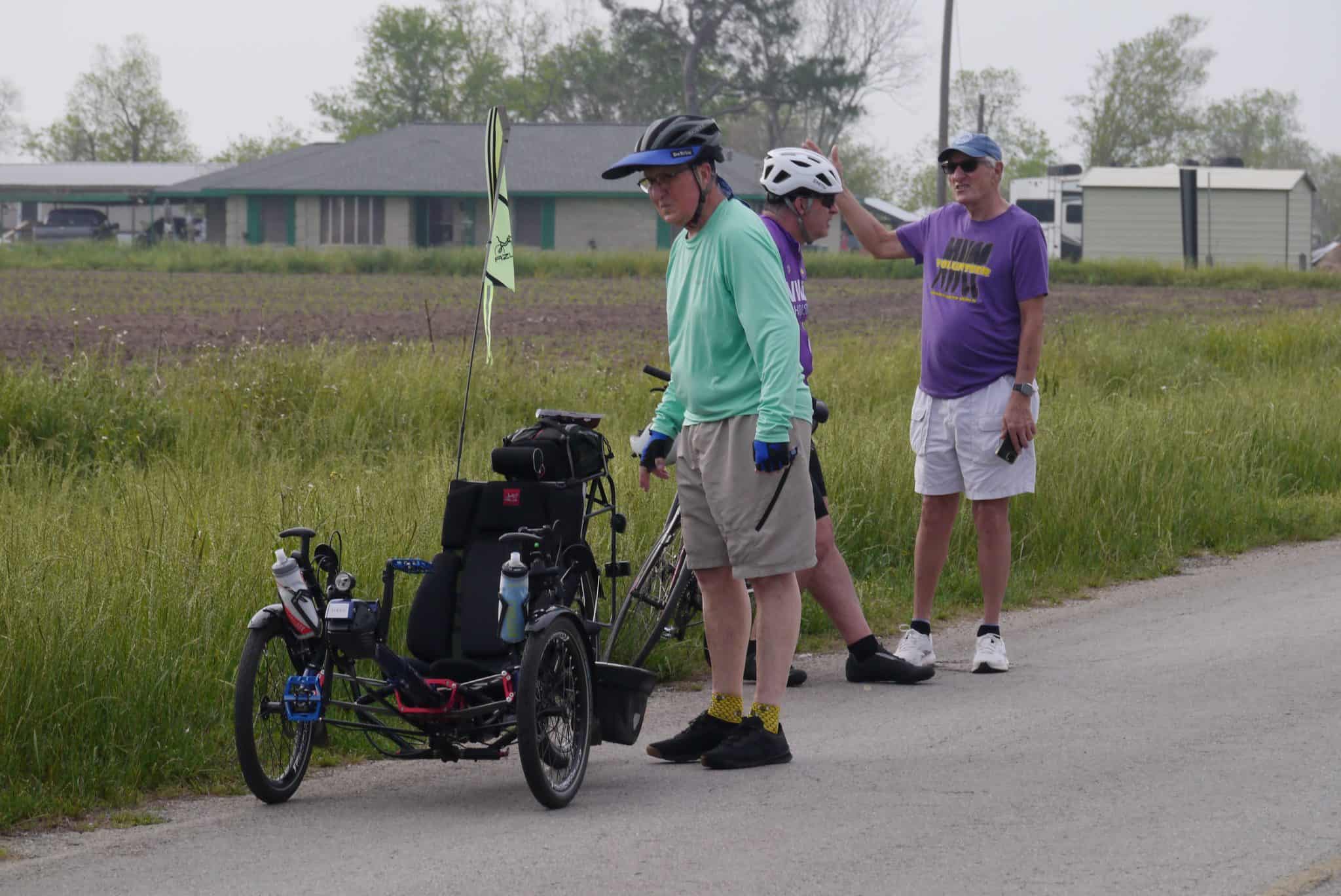 Bicycle touring along Bluebonnet Express, featuring a recumbent tricycle and friendly cyclists.