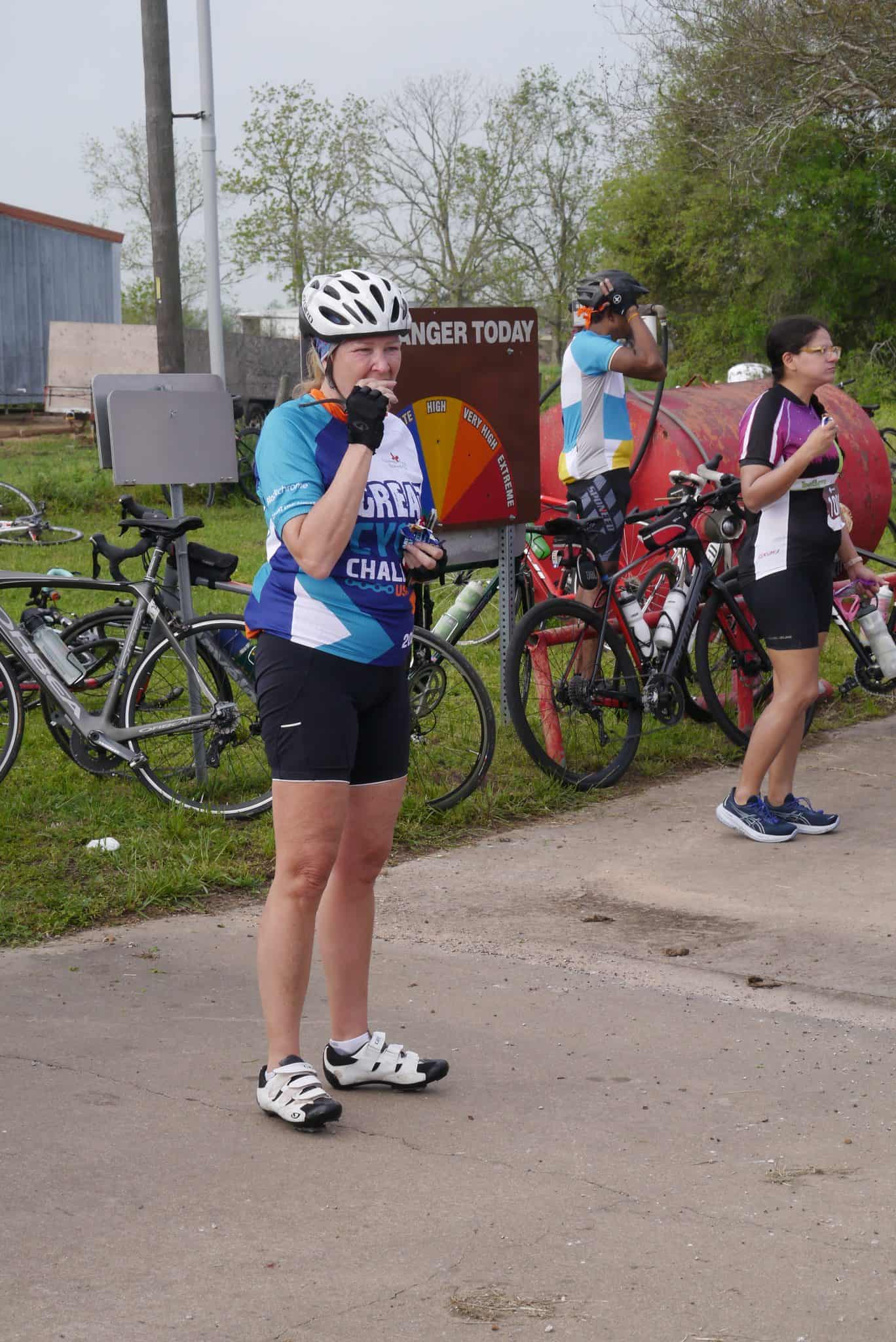 Cyclist enjoying the Bluebonnet Express biking event, taking a break and hydrating.