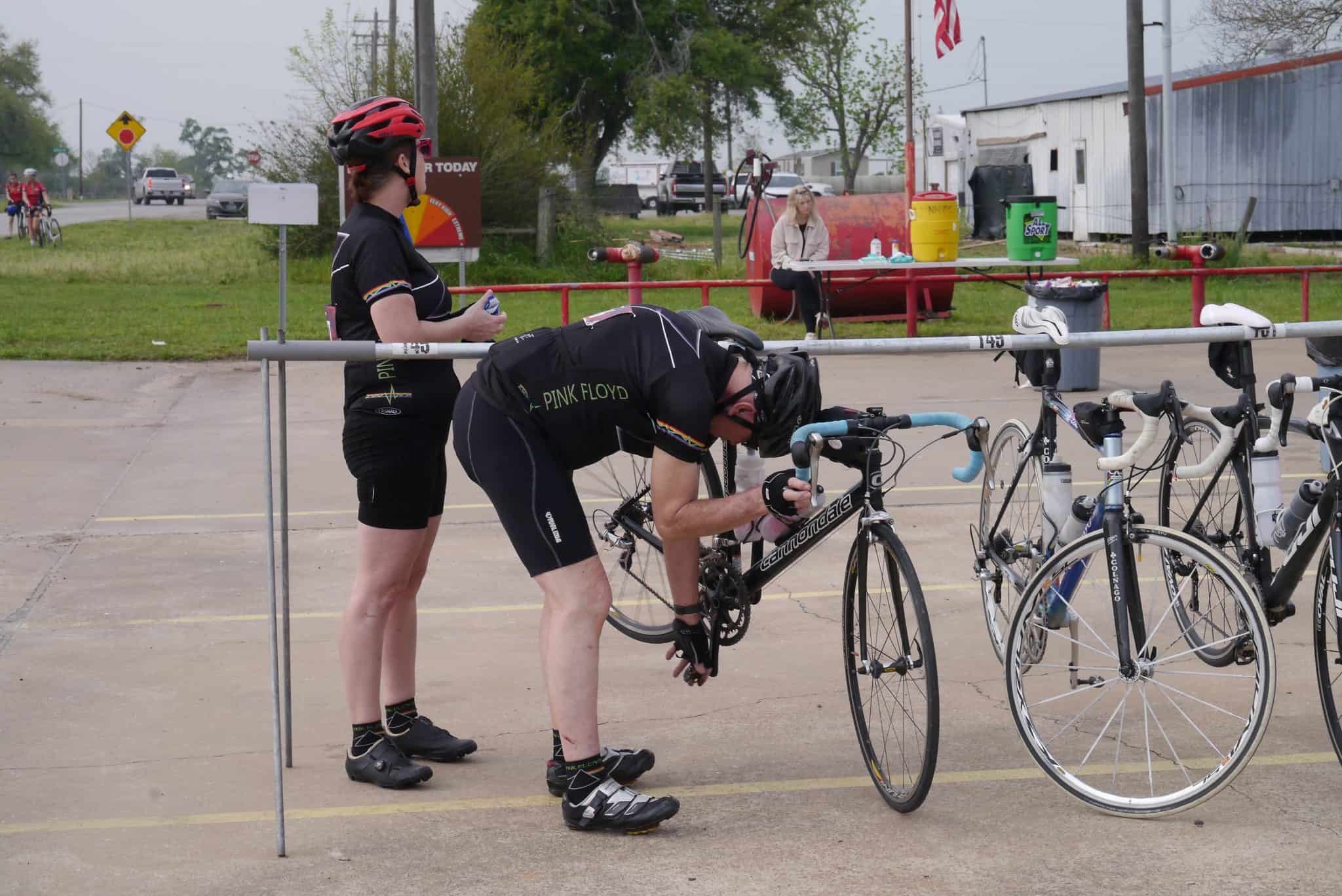 Cyclists preparing for a ride, with a support team at Bluebonnet Express cycling event in Texas.
