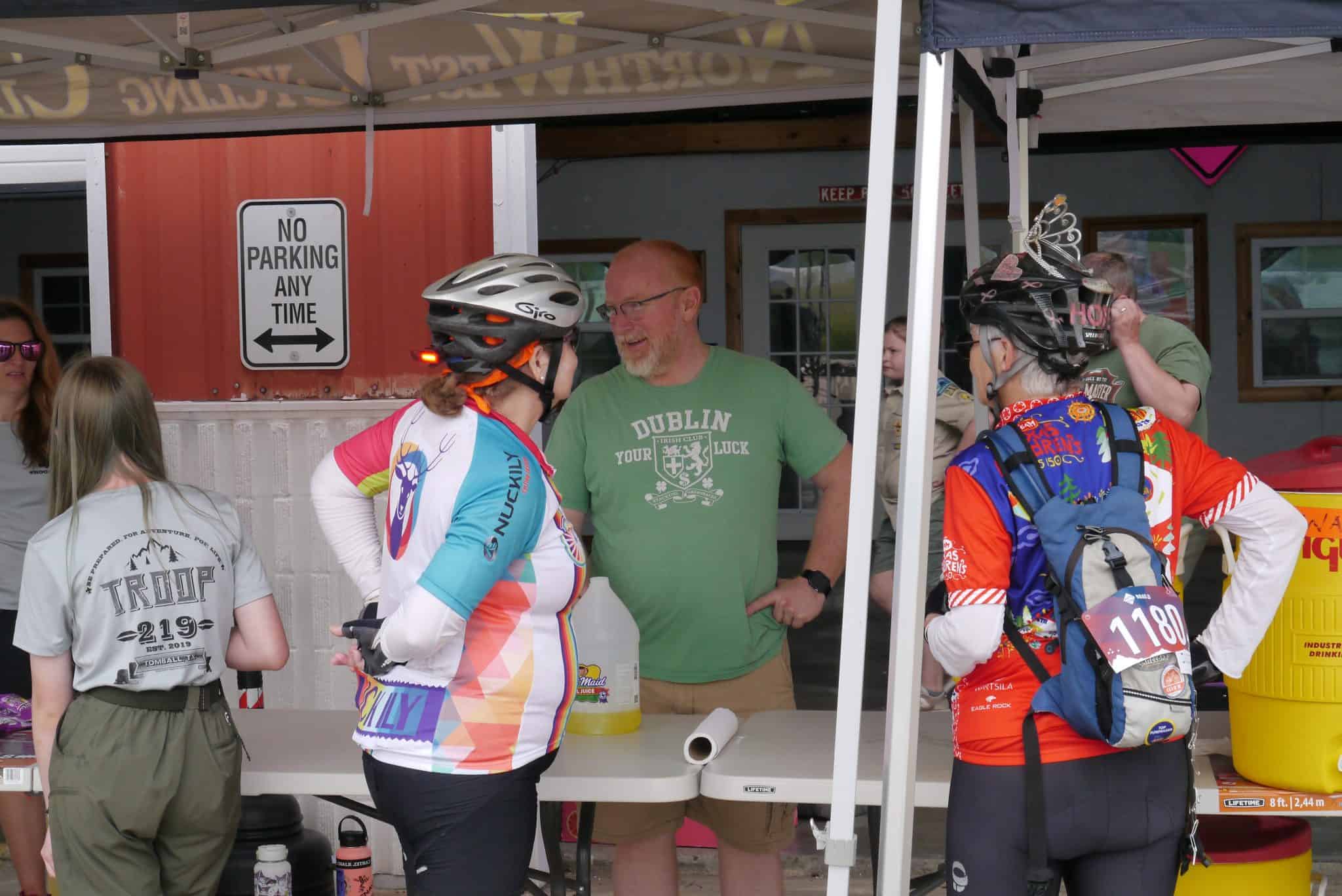 1. Friendly cyclists and staff at Bluebonnet Express cycling event registration.