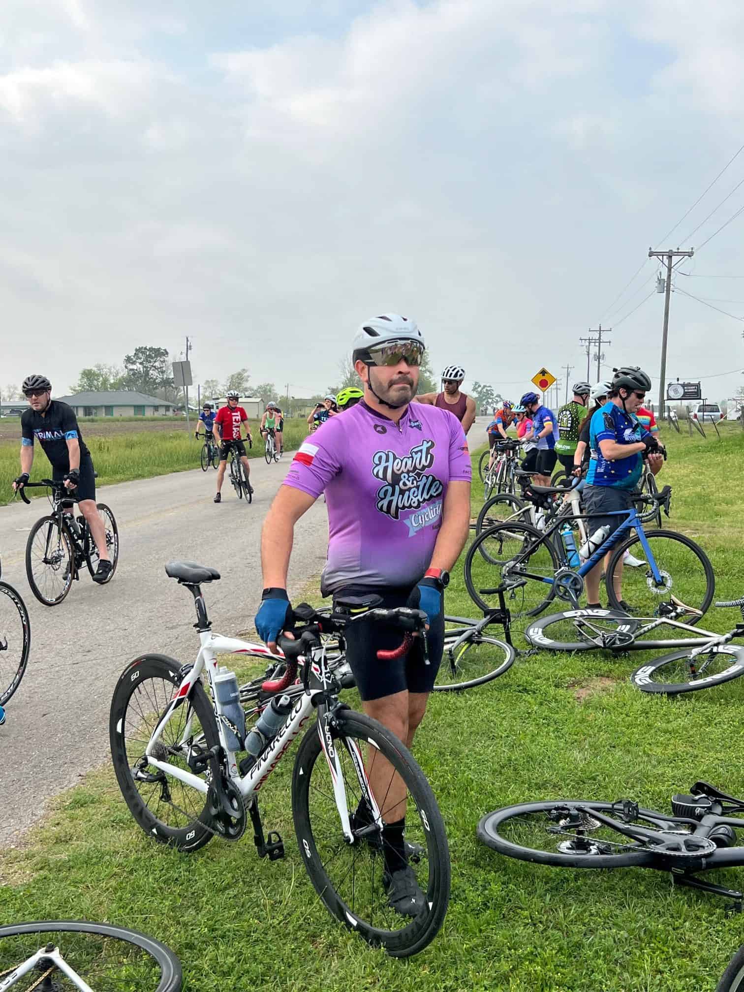 Riders participating in the Bluebonnet Express cycling event with scenic rural background.