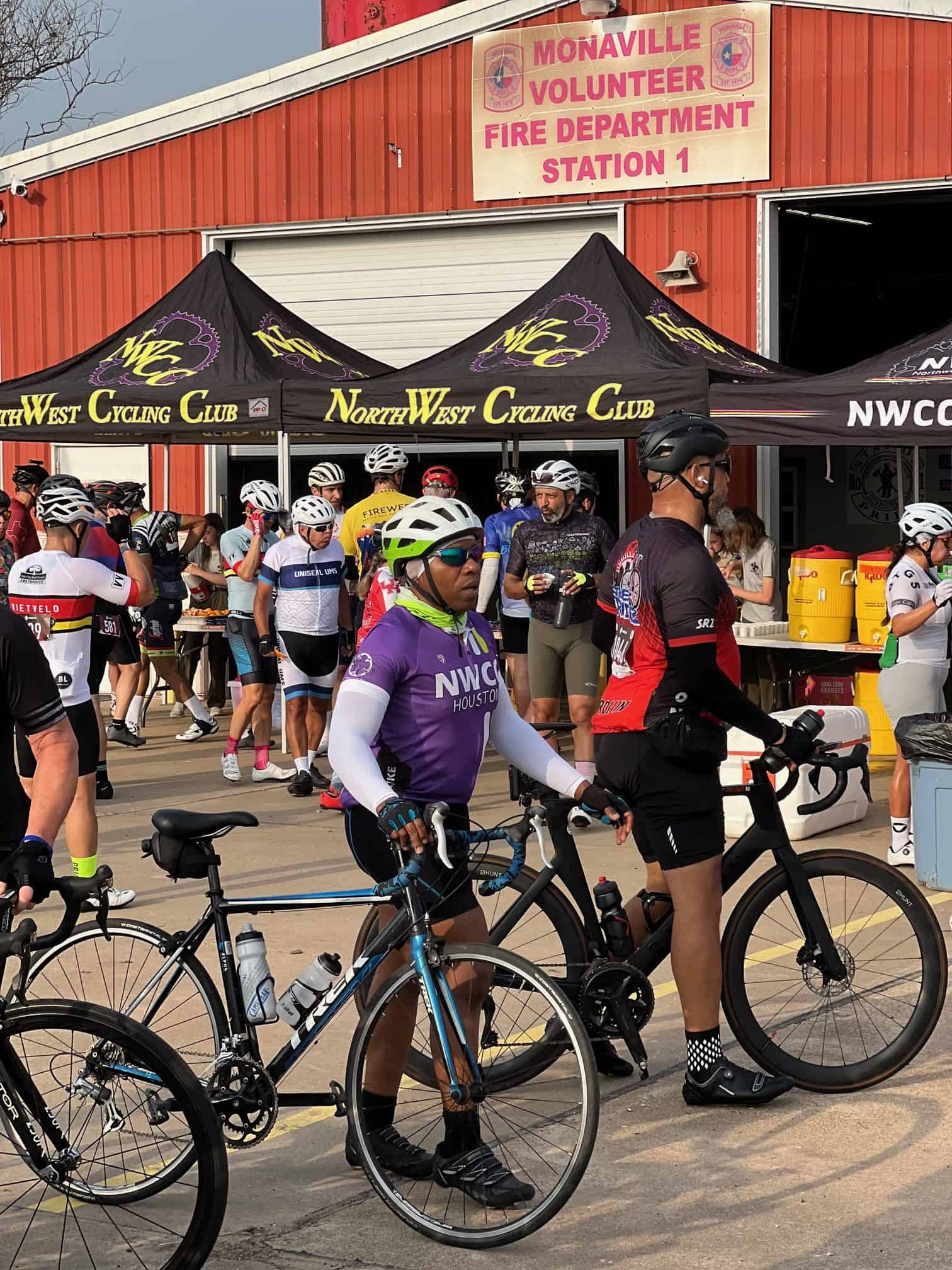 Cyclists at the Bluebonnet Express event, showcasing cycling gear and community support in Texas.