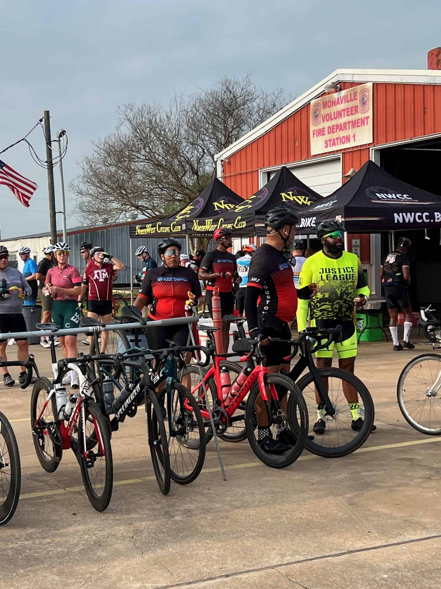 Bicycle race event at Bluebonnet Express, outdoor scene with cyclists and support tents.