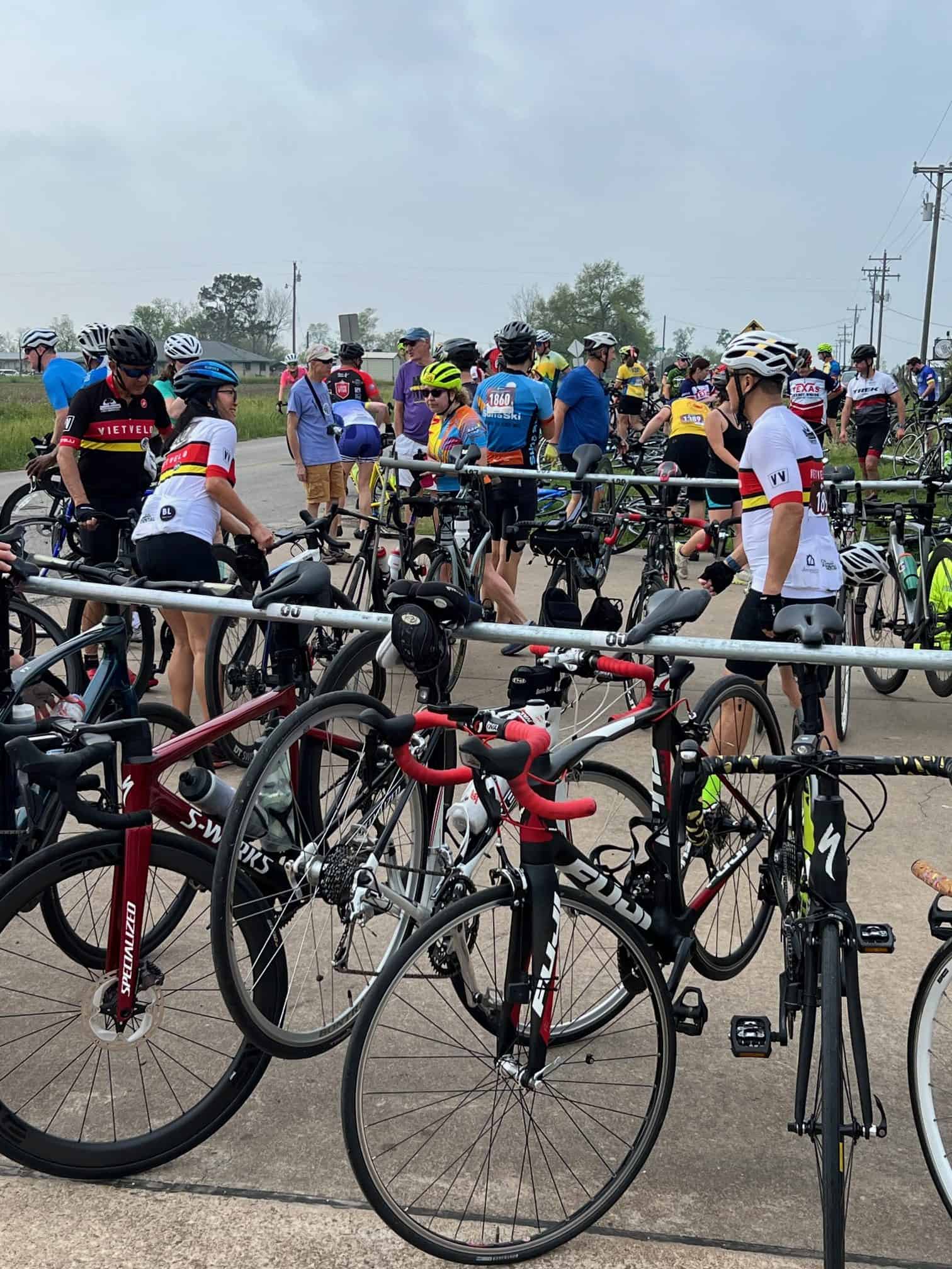 Vast group of cyclists assembled at Bluebonnet Express event, ready for a scenic ride, showcasing biking passion and community.