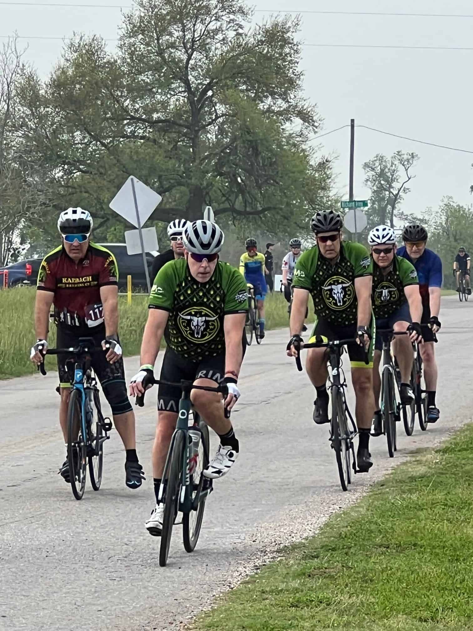 Cyclists riding on the road during Bluebonnet Express bike event.
