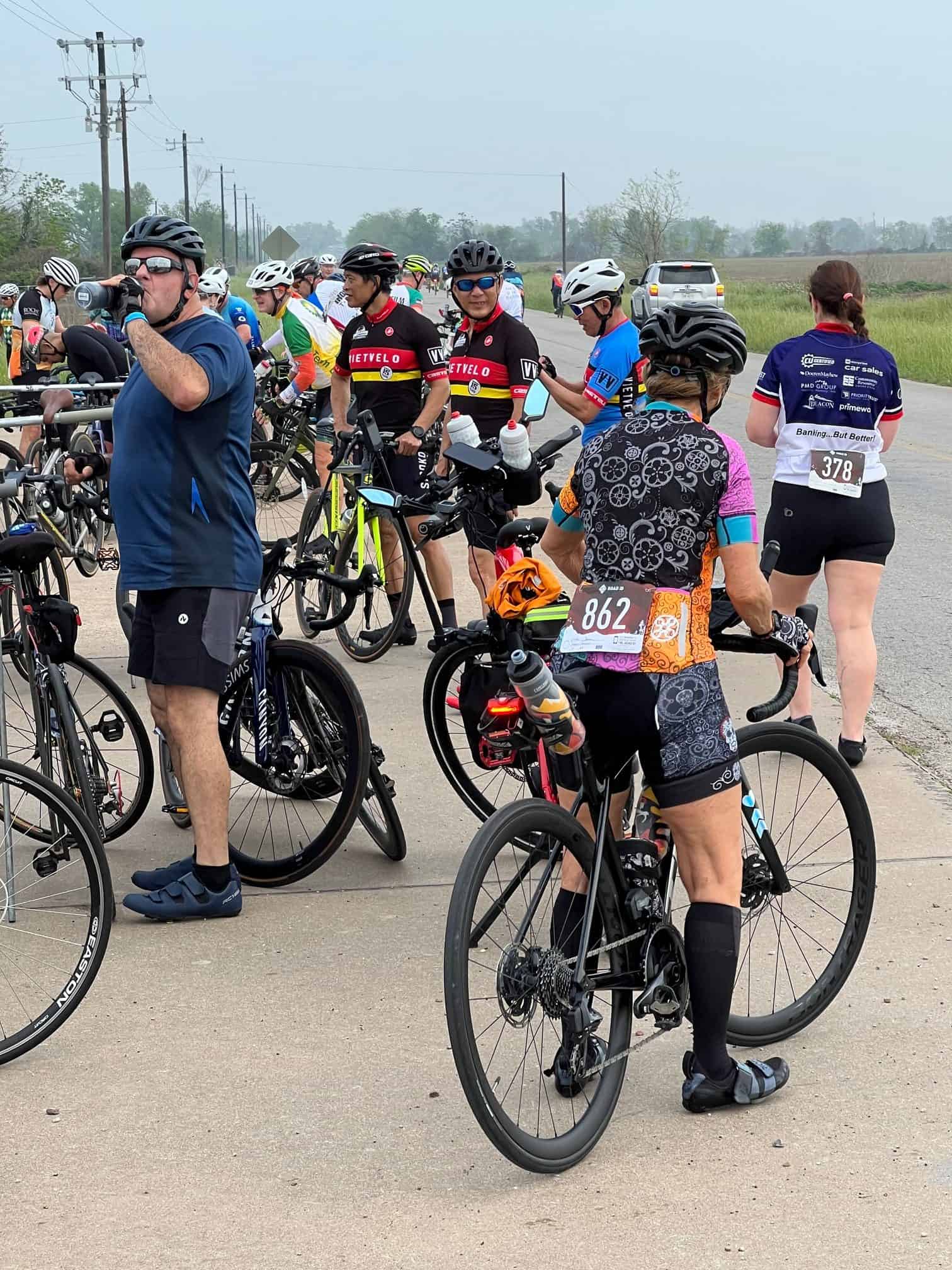 Bicycle race participants gathering at Bluebonnet Express event, cycling enthusiasts ready for race.